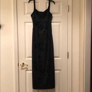 Black gown with velvet flowers and trim